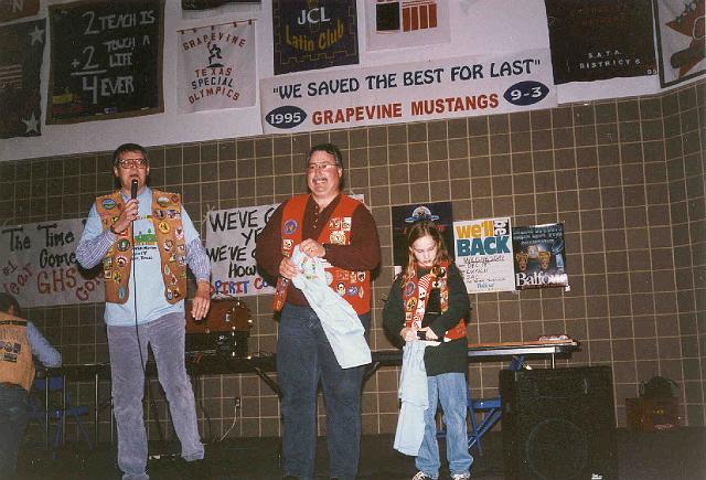 Gretchen Williams win T-Shirt Contest, Bob Eilenfeldt presents as her Marty watches.jpg